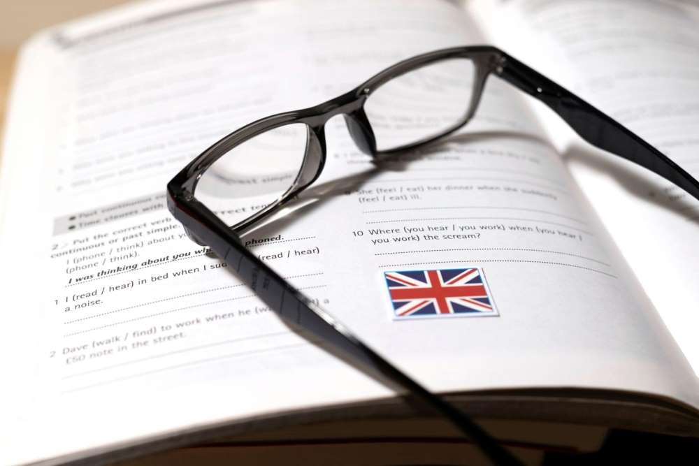 english-book-with-glasses-on-table